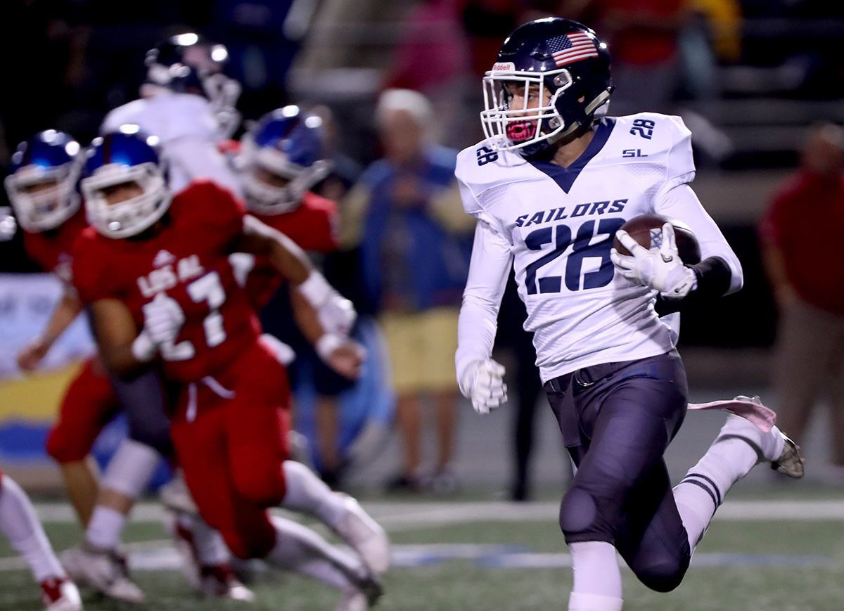 Newport Harbor High School football player #28 Raphael Cruz finds running room during a return in away game vs. Los Alamitos High School, at Cerritos College in Norwalk on Friday, Oct, 5m 2018. NHHS lost 7-42.