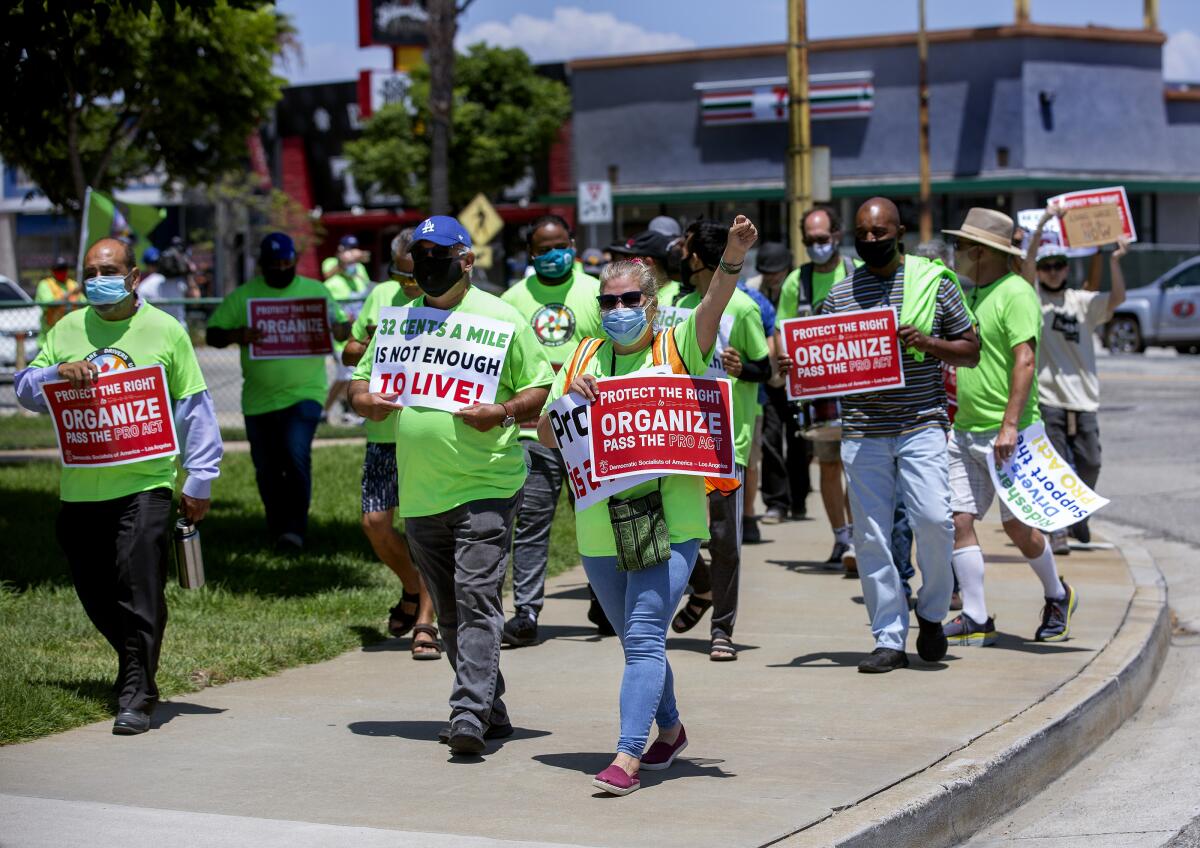 Rideshare drivers walk along Sepulveda Boulevard near LAX