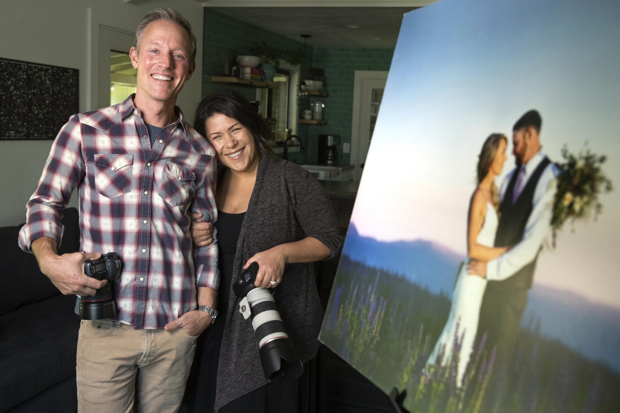 Wedding photographers Andrew Mishler and his wife Melanie, at their home in Penn Valley