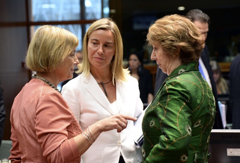 Catherine Ashton, the European Union's top diplomat, talks with Italian Foreign Affairs Minister Federica Mogherini, center, and Croatian Foreign Affairs Minister Vesna Pusic, left, prior to the start of a meeting of EU foreign ministers in Brussels on July 22.