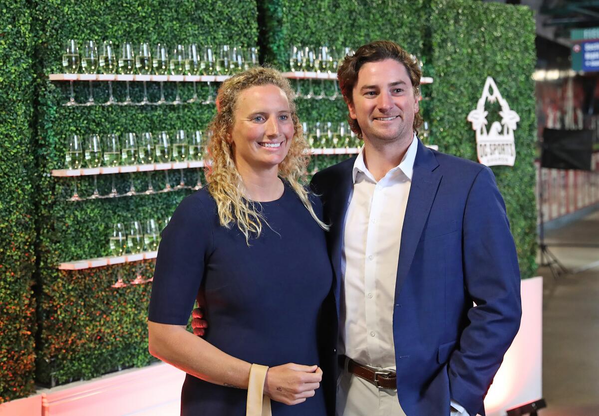 Evolution Award honoree Kaleigh Gilchrist, left, and husband Tom Gehret, arrive at the inaugural OC Sports Awards.