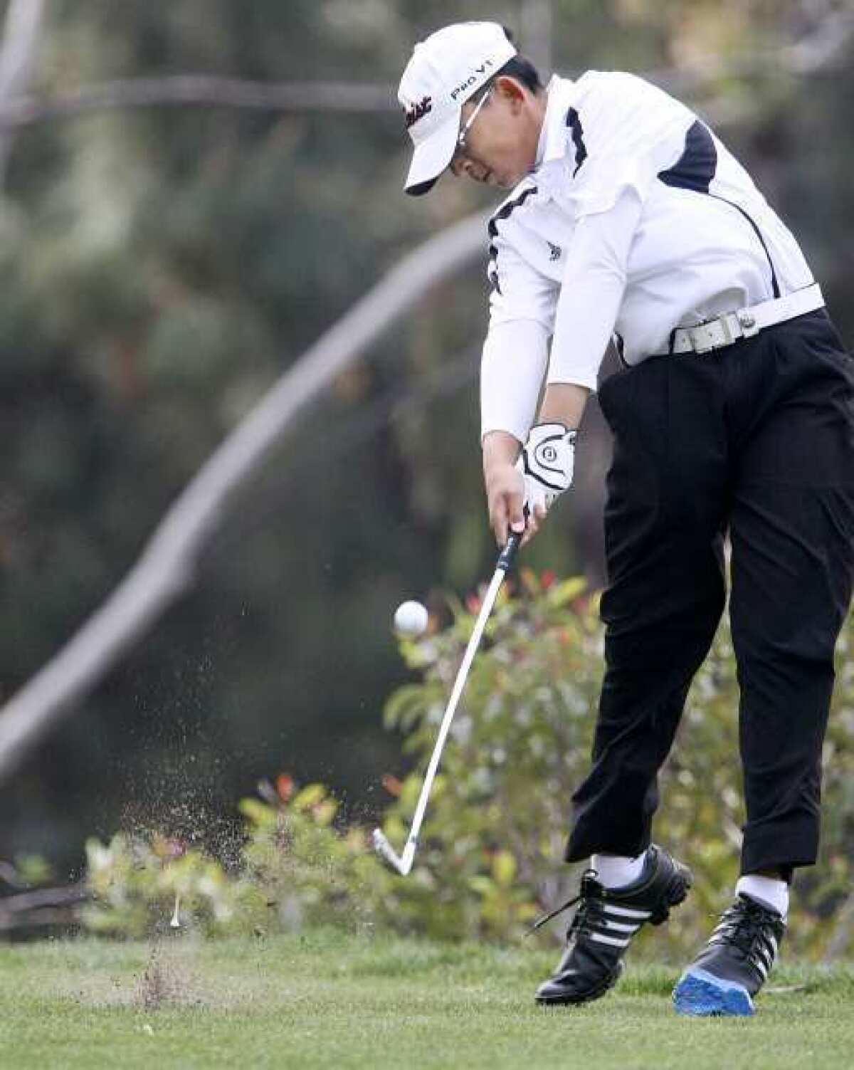 Glendale HIgh's Russell Caletena hits the ball during the De Bell Golf Club's 49th Annual High School Invitational at the course in Burbank on Wednesday, March 20, 2013. Caletena carded a two-over-par 73 on Thursday, April 18, 2013 to finish sixth overall at Santa Anita Golf Course.