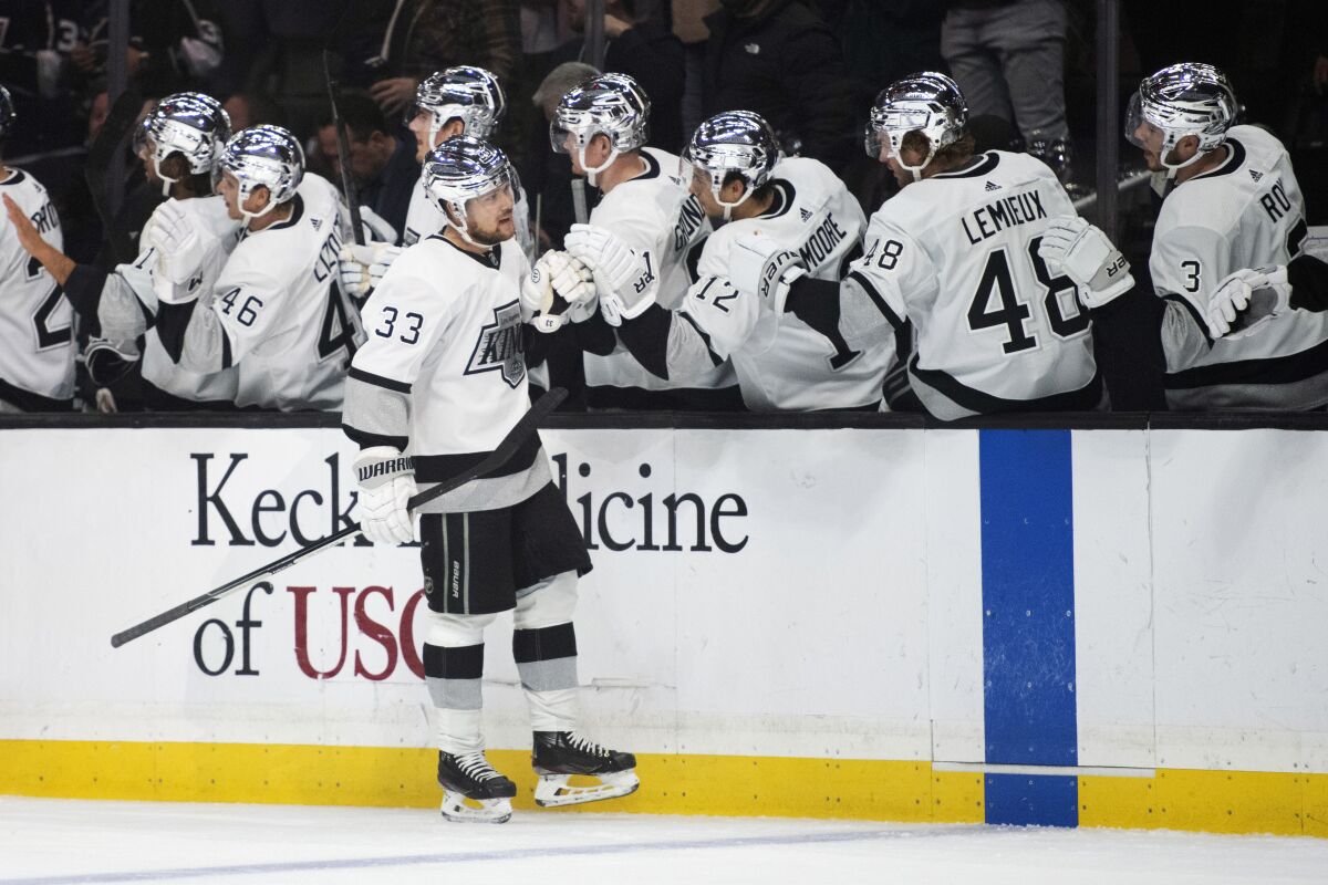 Kings forward Viktor Arvidsson celebrates with teammates after scoring a goal.