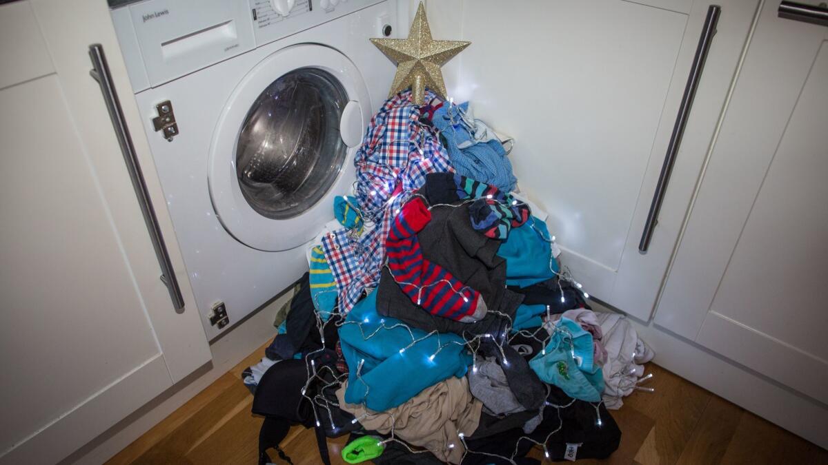 Laundry Christmas tree. One of four photos that are part of a motherhood documentary project by photographer Elizabeth Dalziel. Elizabeth Dalziel /Contact Press Images ONE TIME USE ONLY. Photographed on Saturday, Dec. 9, 2017.