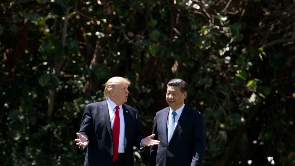 President Trump and Chinese President Xi Jinping speak at Mar-a-Lago in Palm Beach, Fla., on April 7, 2017.