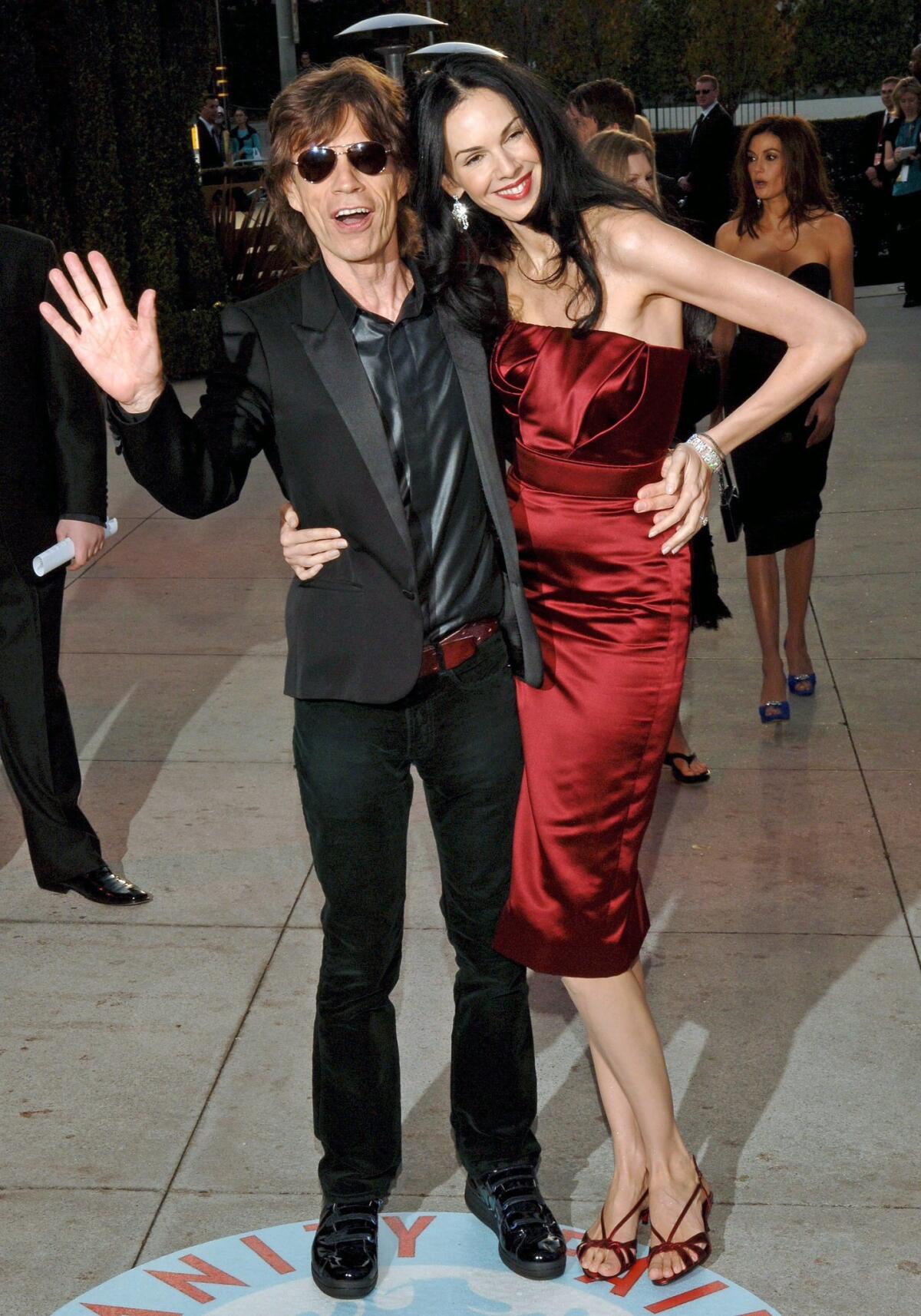 Mick Jagger and L'Wren Scott attend the 2006 Vanity Fair post-Oscars party. The two had been dating for 13 years.