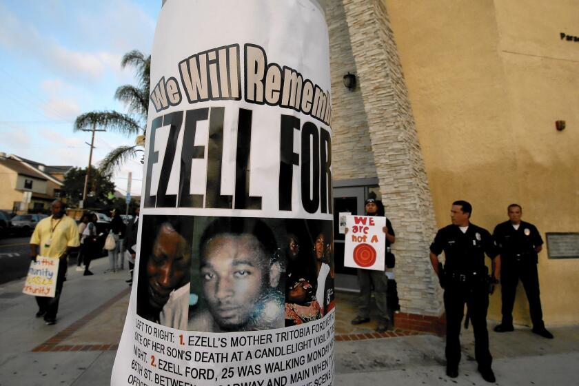 A flier with a picture of Ezell Ford hangs on a light post outside Paradise Baptist Church in South Los Angeles. Ford, 25, was fatally shot by two LAPD officers in August.