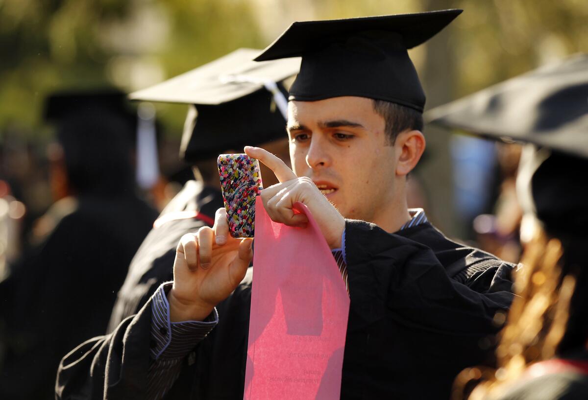 The wages of recent college graduates have fallen over the last decade. Above, a student during graduation at Cal State University Northridge.