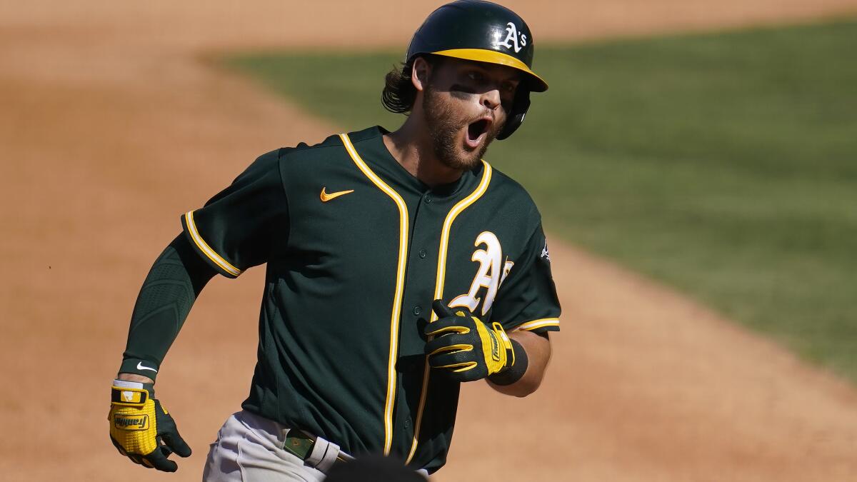 Rookie's first big league hit helps A's rally past Yankees