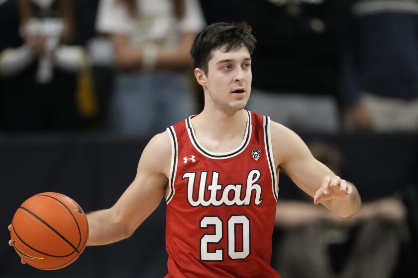 Utah guard Lazar Stefanovic (20) in the first half of an NCAA college basketball game Saturday.