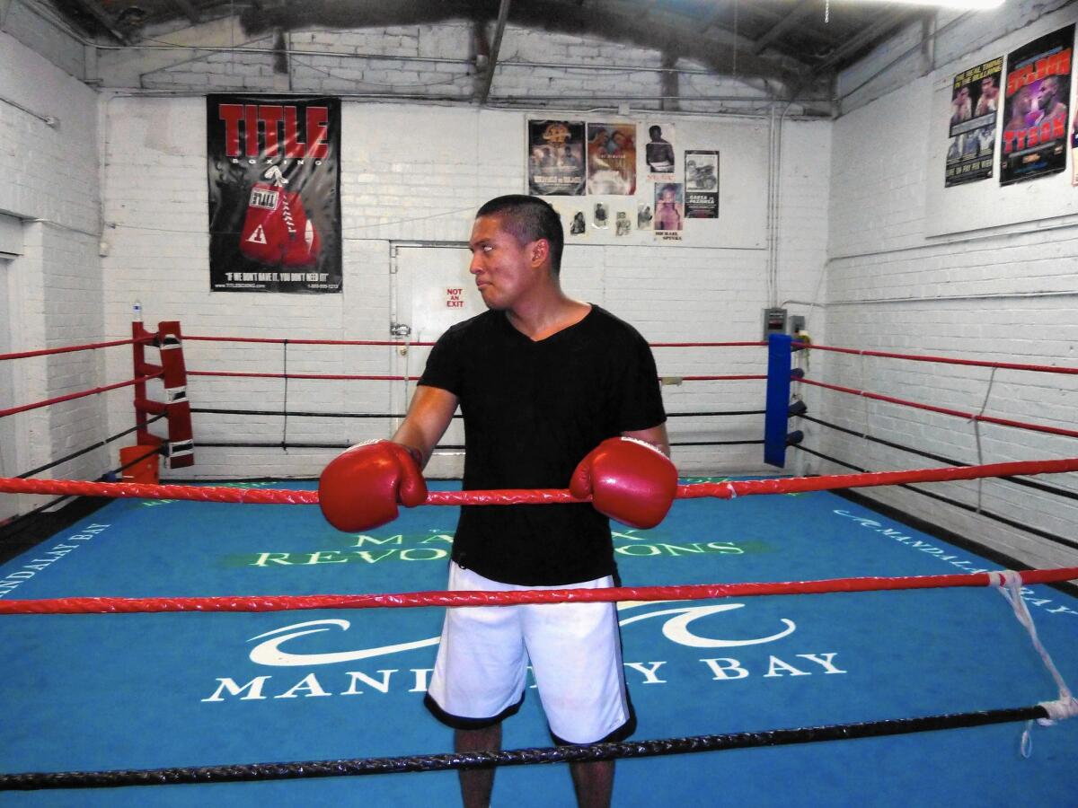 Amateur boxer David Cooper takes a break from sparring at Johnny Tocco’s Ringside Gym near downtown Las Vegas.