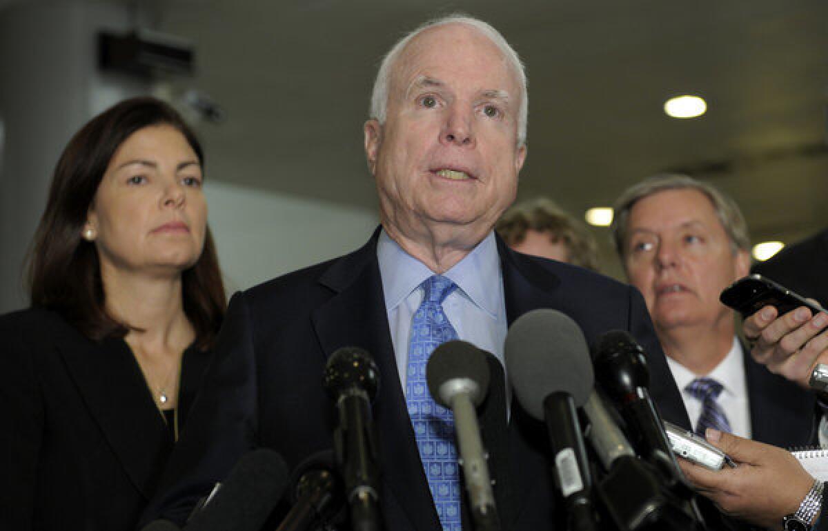 Sen. John McCain (R-Ariz.), Sen. Kelly Ayotte (R-N.H.) and Sen. Lindsey Graham (R-S.C.), speak on Capitol Hill following a meeting with U.N. Ambassador Susan Rice.