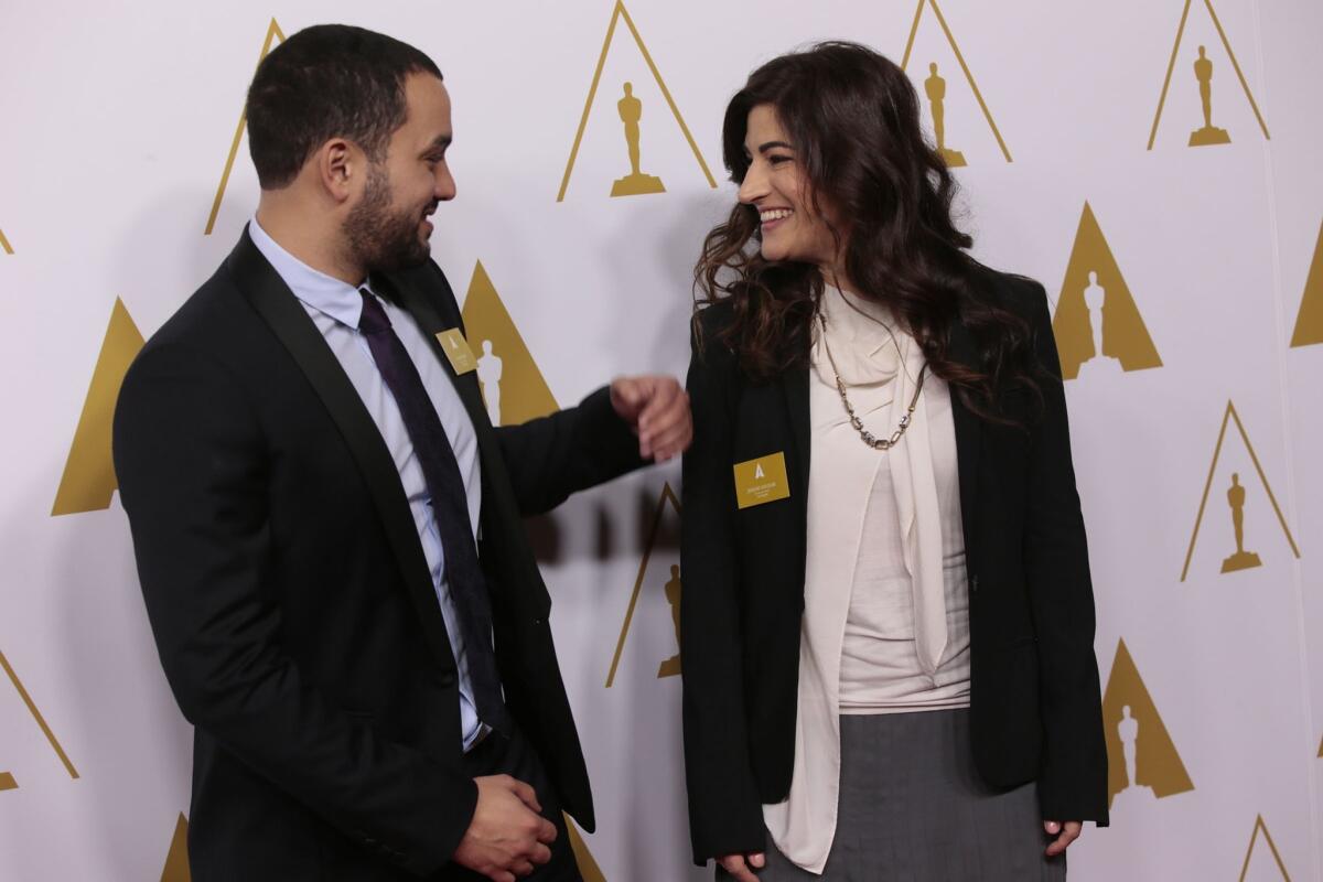 Filmmakers Karim Amer and Jehane Noujaim. 
