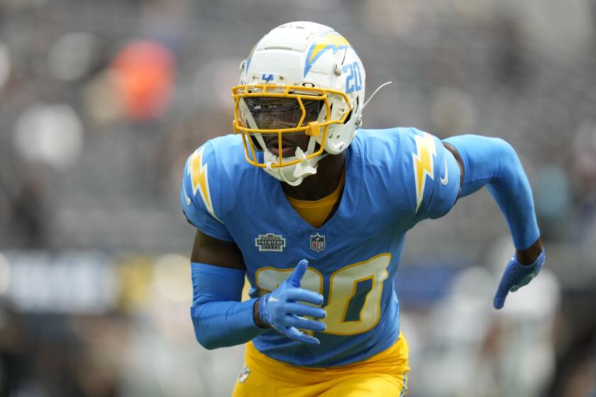 Chargers cornerback Cam Hart works out before a game against the Las Vegas Raiders.