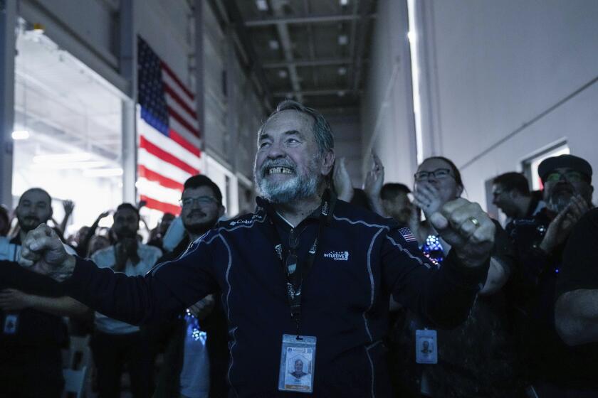 Main Engine Control Computer designer for Intuitive Machines Dan Harrison cheers amongst fellow employees during a watch party moments after they became the first commercial company to softly land on the moon on Thursday, Feb. 22, 2024, in Houston. ( Raquel Natalicchio/Houston Chronicle via AP)