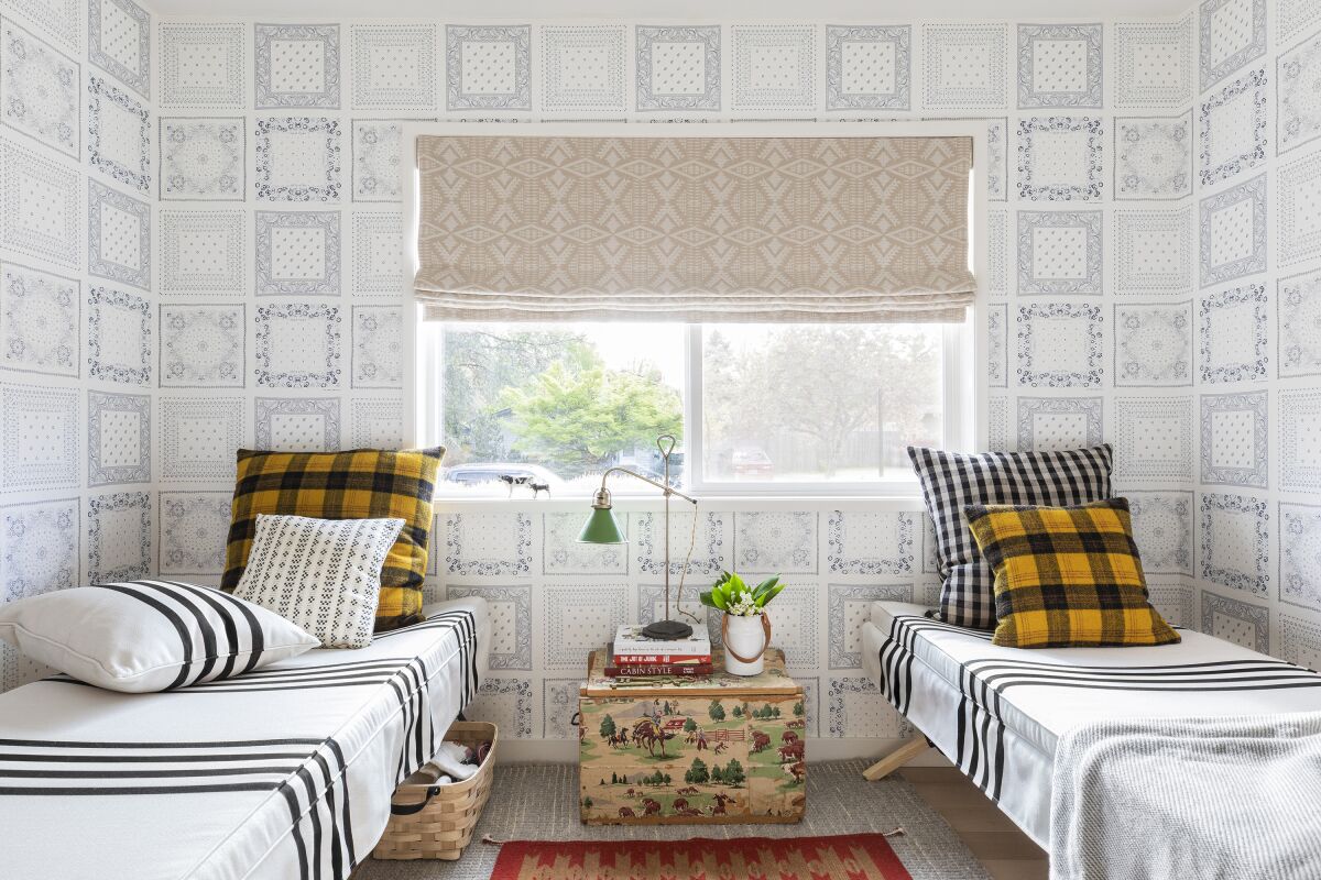 This image released by Portland Oregon-based interior designer Max Humphrey shows a room with a wallpaper design inspired by bandanas. (Christopher Dibble via AP)