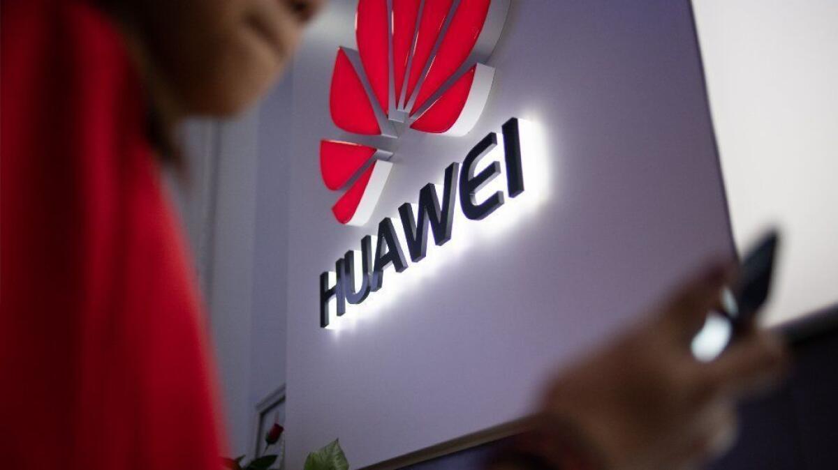 A Huawei logo is displayed at a retail store in Beijing in May 2019.