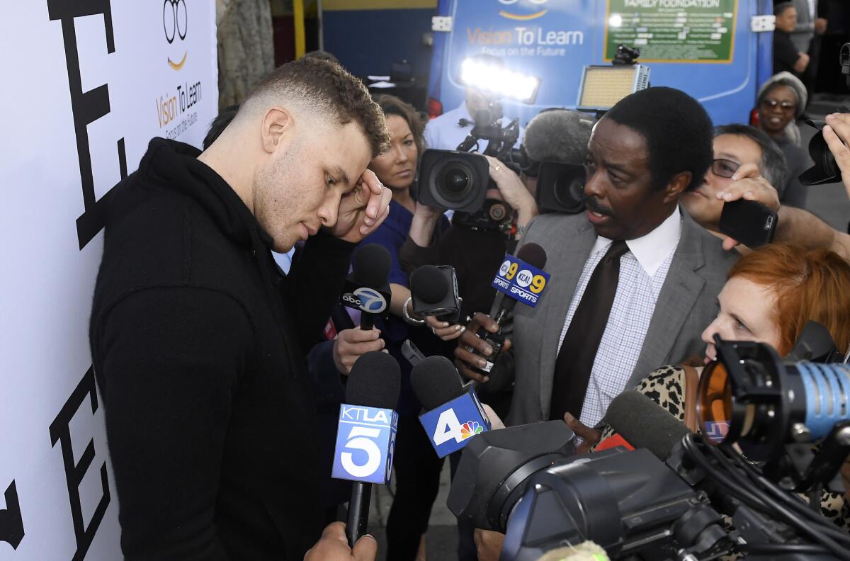 Los Angeles Clippers' Blake Griffin speaks to reporters after giving several kids new glasses at Lovelia P. Flournoy Elementary School, Tuesday, Jan. 16, 2018, in the Nickerson Gardens area of Los Angeles, where the Clippers announced a partnership with Vision to Learn and the Los Angeles Unified School District to provide students with eyeglasses. Over 600,000 students will benefit from the program.