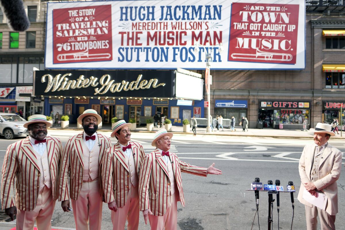 Jefferson Mays, right, as River City's Mayor George Shinn, and the musical's barbershop quartet kick off the opening week of Broadway's "The Music Man" outside the Winter Garden Theatre on Tuesday, Feb. 8, 2022, in New York. (Photo by Charles Sykes/Invision/AP)