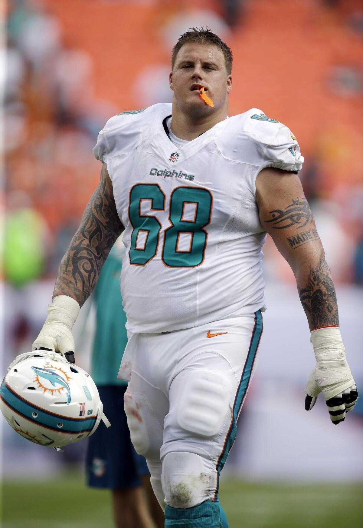 Miami Dolphins offensive lineman Richie Incognito remains under paid suspension as the NFL continues its investigation involving his alleged role in the team's bullying scandal.