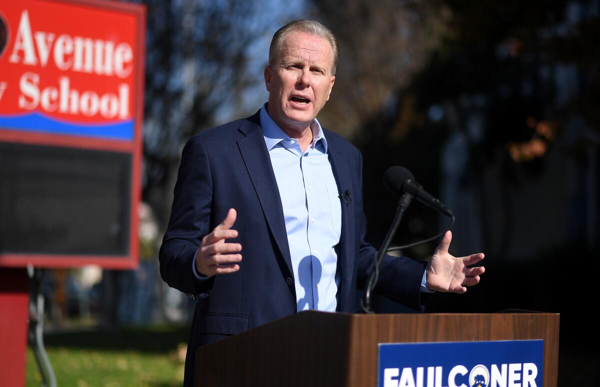 Kevin Faulconer speaks at a news conference in front of a school