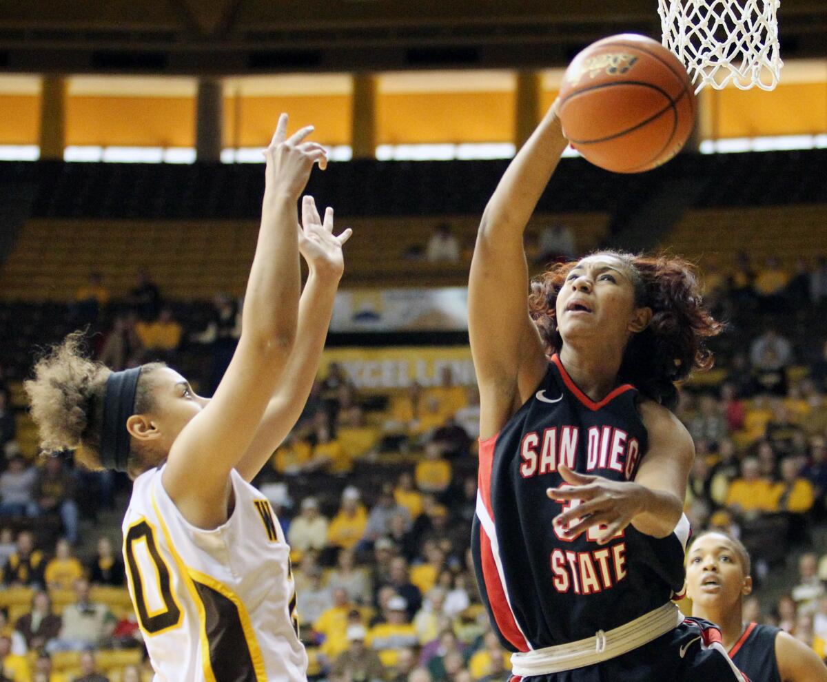 Paris Johnson, shown playing for San Diego State in 2011 against Wyoming, is the new girls basketball head coach at Bishop's.