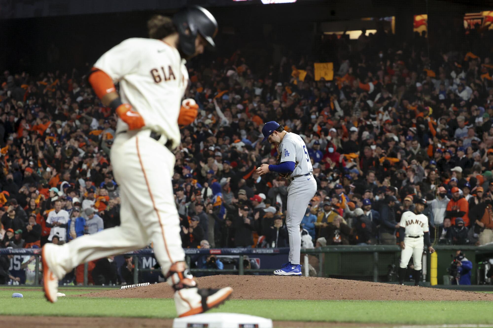 Dodgers relief pitcher Alex Vesia reacts after allowing a solo home run to Giants' Brandon Crawford 