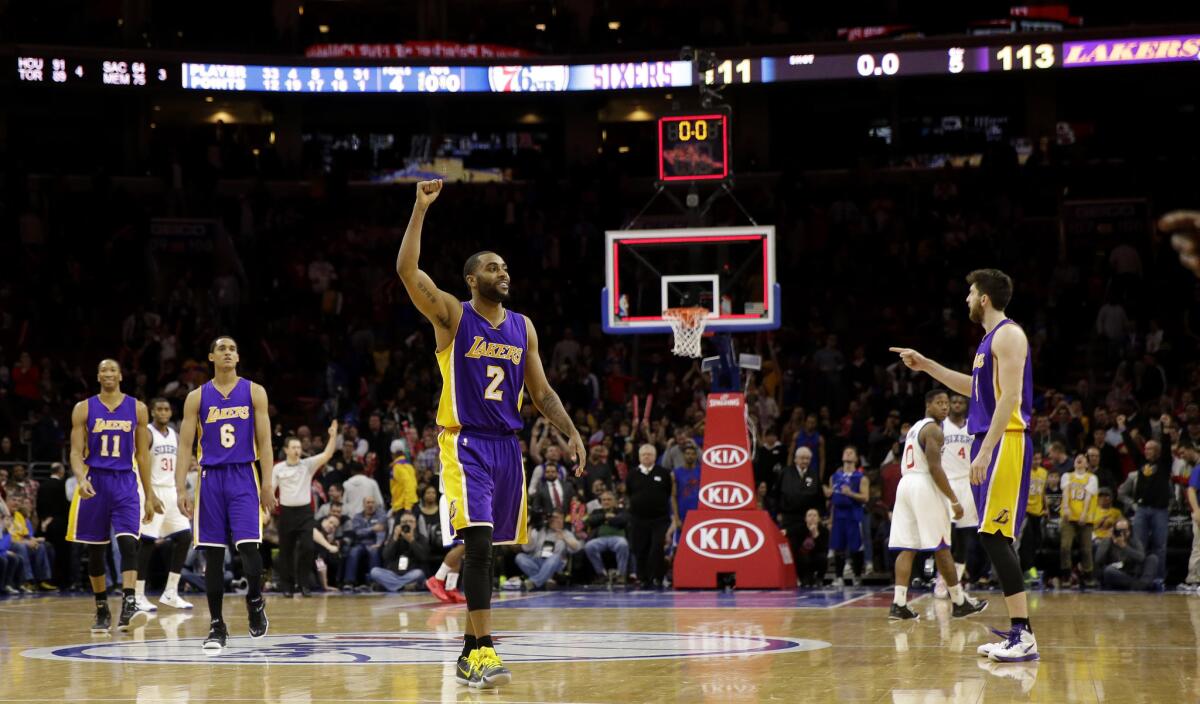 Lakers shooting guard Wayne Ellington (2) celebrates after the Lakers' 113-111 overtime victory against the 76ers.