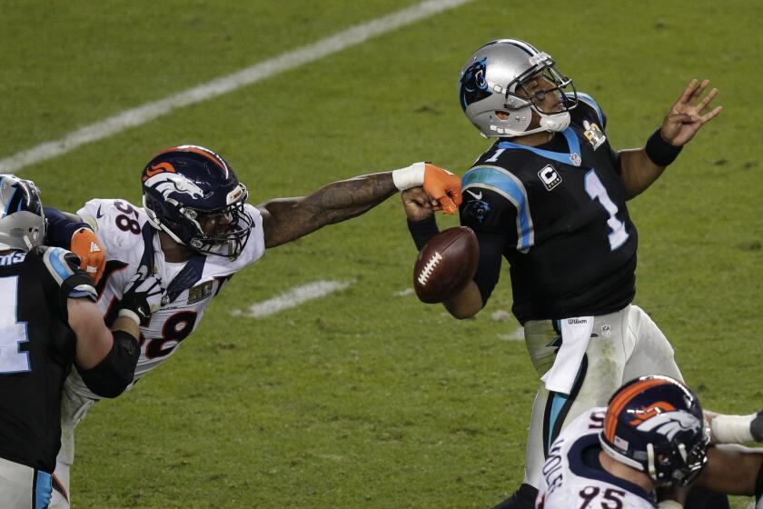 FILE - In this Feb. 7, 2016, file photo, Denver Broncos' Von Miller (58) strips the ball from Carolina Panthers' Cam Newton (1) during the second half of the NFL Super Bowl 50 football game in Santa Clara, Calif. (AP Photo/Charlie Riedel, File)
