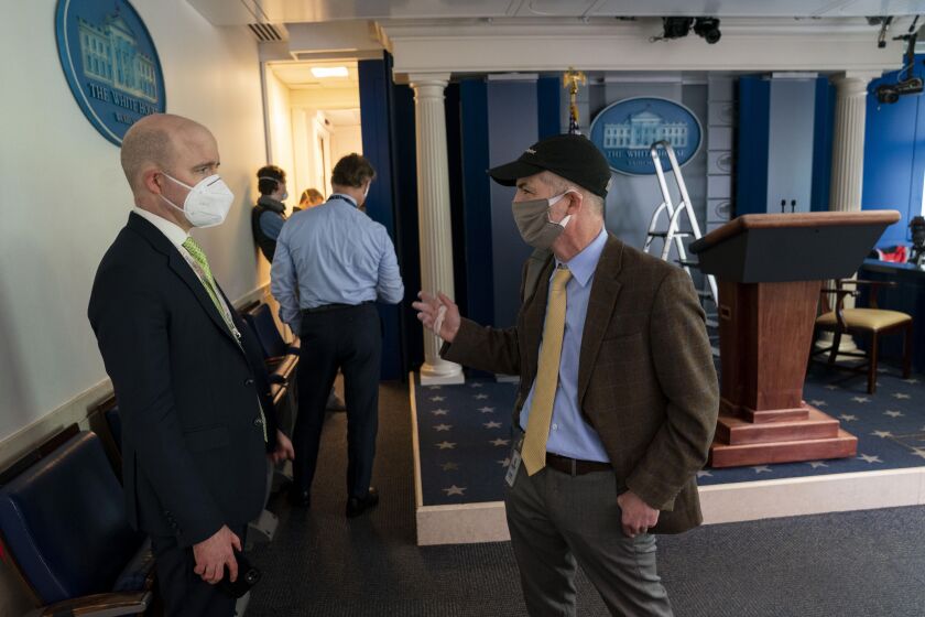 NYTVIRUS - Members of the White House Press Corps line up in the White House Briefing room to get tested for the Coronavirus, Tuesday, May 12, 2020. Los Angeles Times reporter Noah Bierman (right) speaks with Jeff Mason (Reuters reporter). ( Photo by Doug Mills/The New York Times)