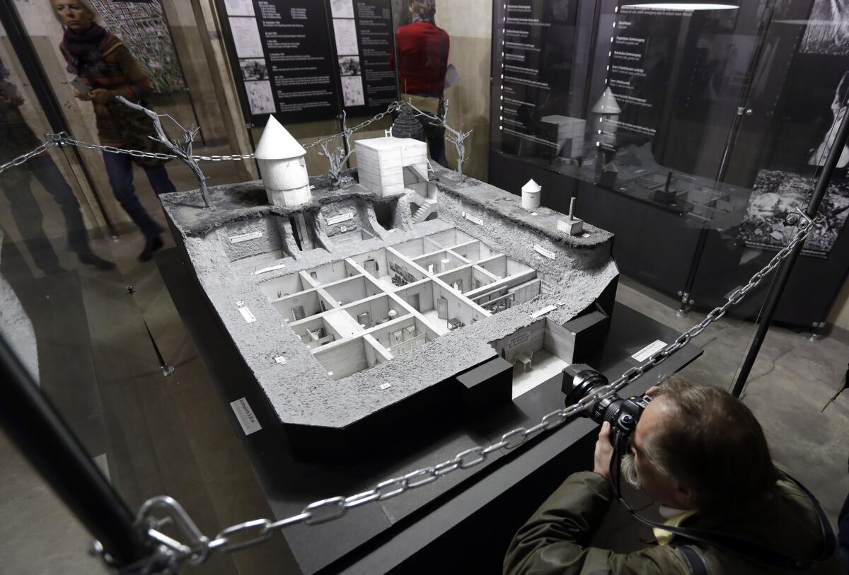 A photographer takes a picture of a model of Adolf Hitler's bunker on Oct. 27, 2016. The model is part of an exhibition, located in another World War II bunker, which offers an overview of the history of Hitler's bunker and the end of the war.