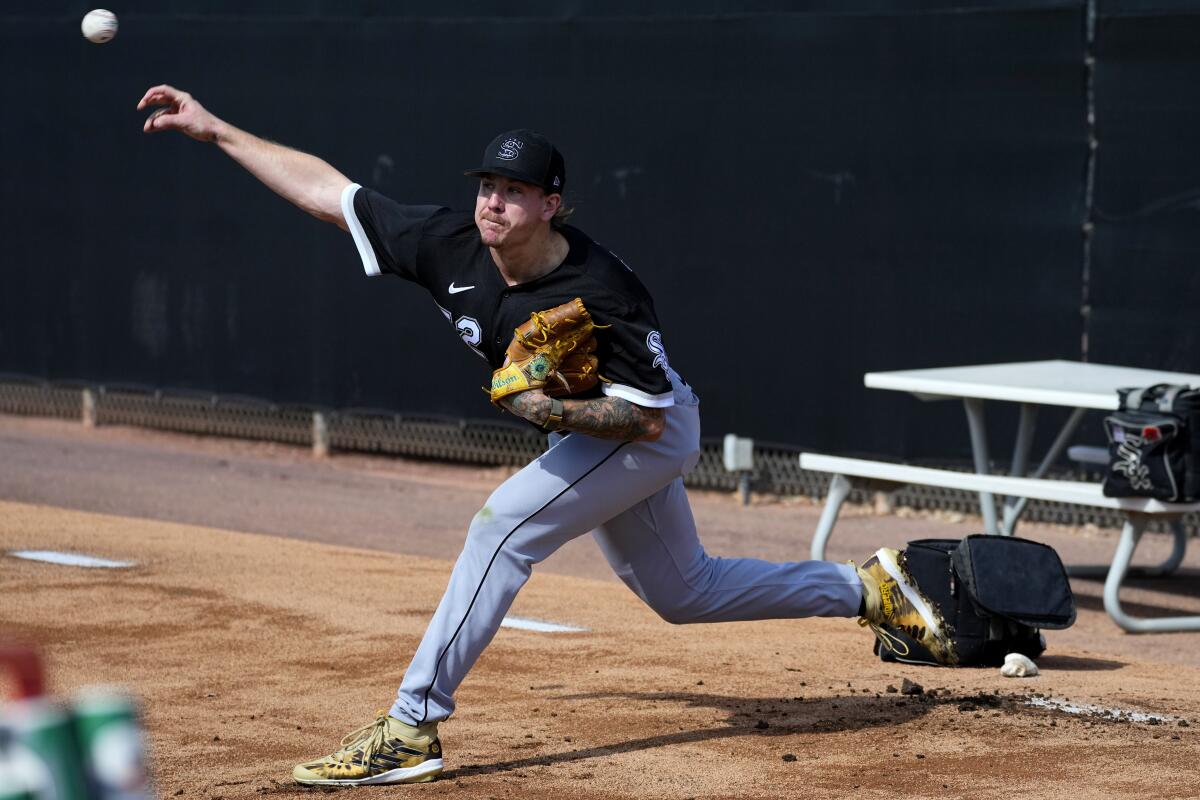 Chicago White Sox pitcher Mike Clevinger throws during an MLB spring training baseball practice.