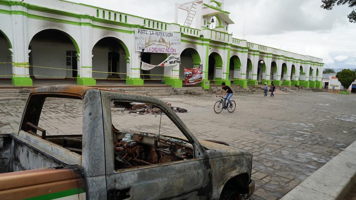 Protesters angered at police violence on June 19th burned down a number of buildings, including City Hall and police headquarters. (Liliana Nieto del Rio / For The Times)