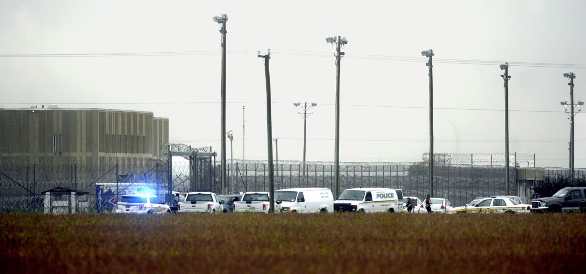 In this photo, police vehicles are seen outside Pasquotank Correctional Institution in Elizabeth City, N.C