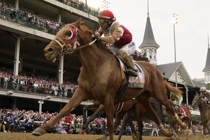 Rich Strike, with Sonny Leon aboard, wins the 148th running of the Kentucky Derby.