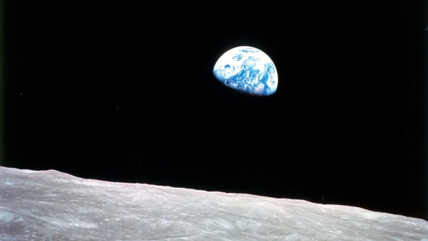 Taken by astronaut William Anders from the Apollo 8 spacecraft, this December 1968 photo of Earth rising over the lunar surface would become one of the most famous images of the 20th century.