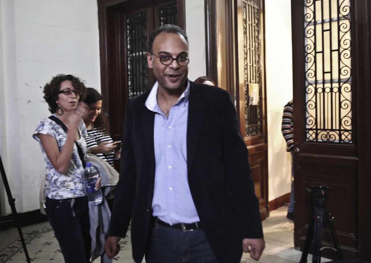 Journalist and human rights advocate Hossam Bahgat is greeted by colleagues and friends at the office of the Egyptian Initiative for Personal Rights in Cairo after his release from detention.