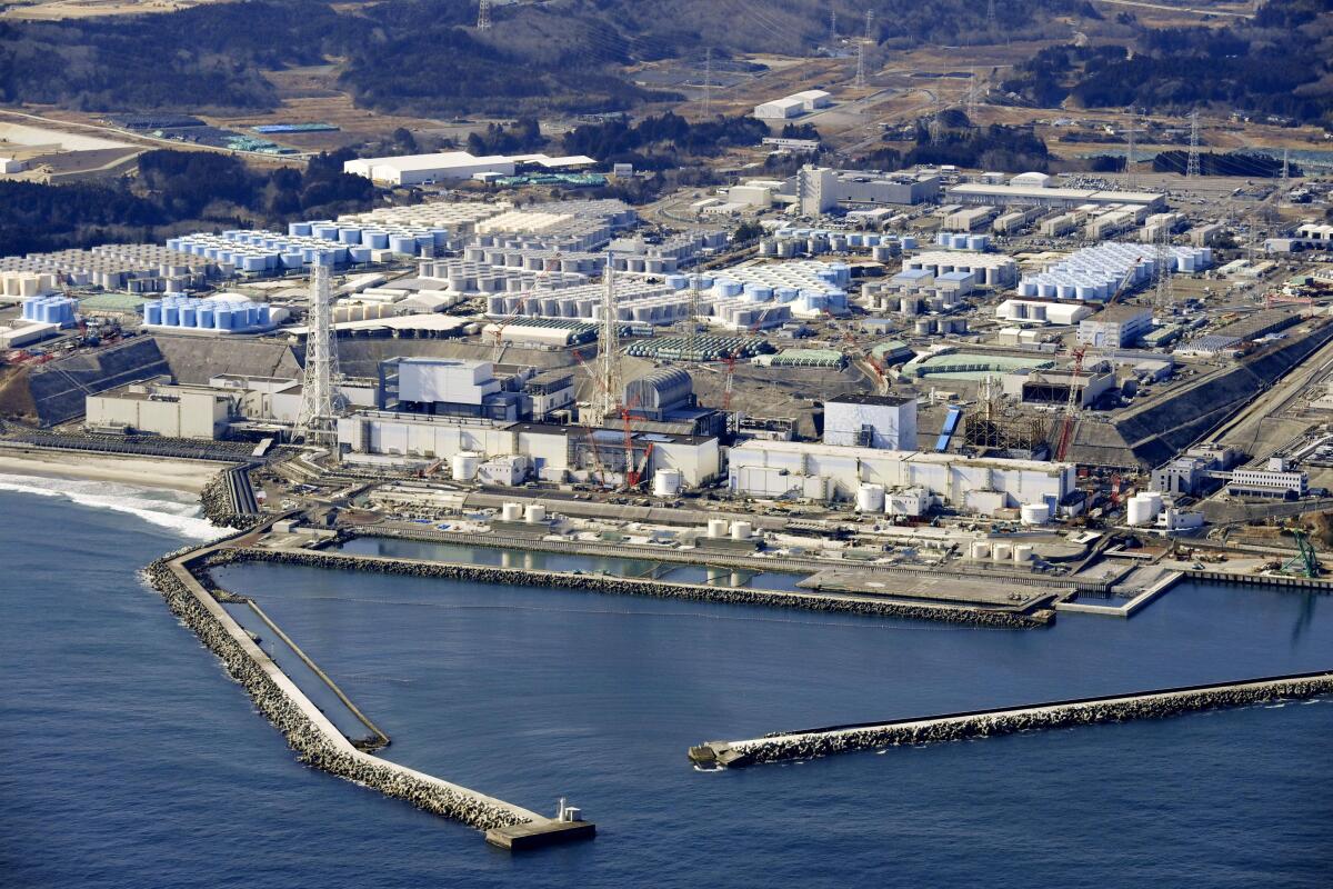 FILE - This aerial photo shows Fukushima Daiichi nuclear power plant in Okuma town, Fukushima prefecture, north of Tokyo, on Feb. 13, 2021. The construction of facilities needed for a planned release of treated radioactive wastewater into the sea next year from the damaged Fukushima nuclear power plant began Thursday, Aug. 4 ,2022, despite opposition from the local fishing community. (Kyodo News via AP, File)