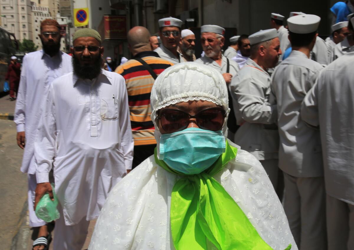 A Muslim pilgrim wears a surgical mask to guard against MERS in Mecca, Saudi Arabia, on Tuesday.