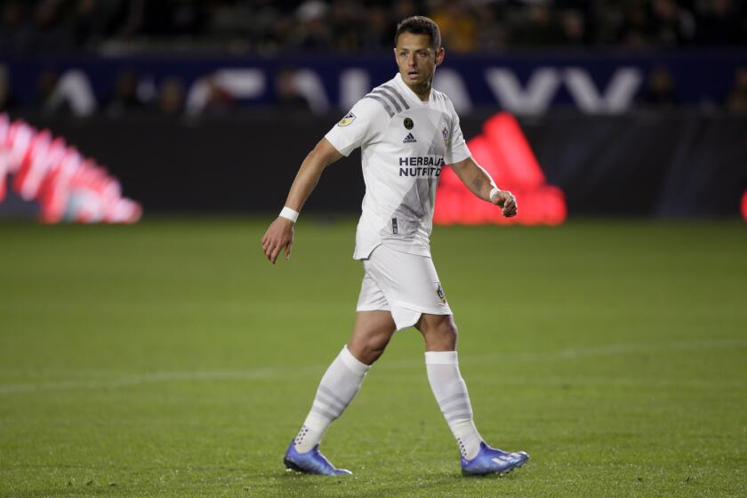 LA Galaxy forward Javier Hernandez walks on the pitch against the Vancouver Whitecaps during the second half of an MLS soccer match in Carson, Calif., Saturday, March 7, 2020. (AP Photo/Alex Gallardo)