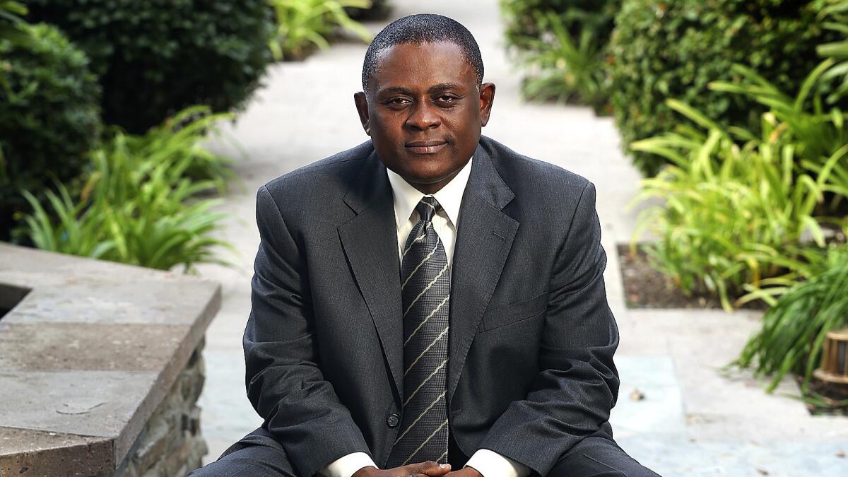 Dr. Bennet Omalu, the forensic pathologist who first identified CTE in a pro football player and is played by Will Smith in the movie "Concussion," is photographed at the Fairmont Miramar Hotel in Santa Monica on Dec. 10, 2015.