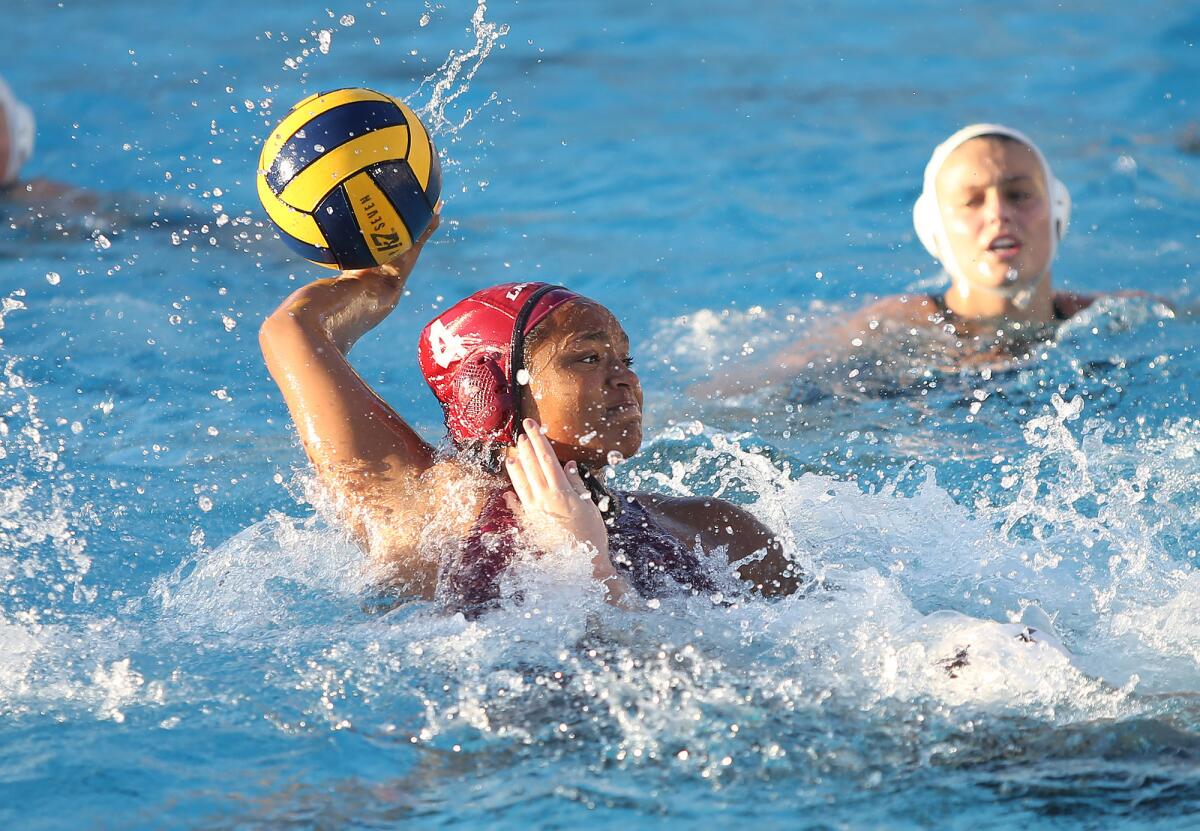 Laguna Beach's Imani Clemons (4), show taking a shot in a Feb. 7 match against Mira Costa, helped the Breakers beat Yorba Linda 19-3 in the first round of the CIF Southern California Regional Division I playoffs on Friday.