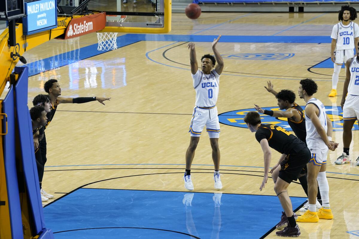 UCLA guard Jaylen Clark makes a free throw to give UCLA the lead with 1.4 seconds remaining.
