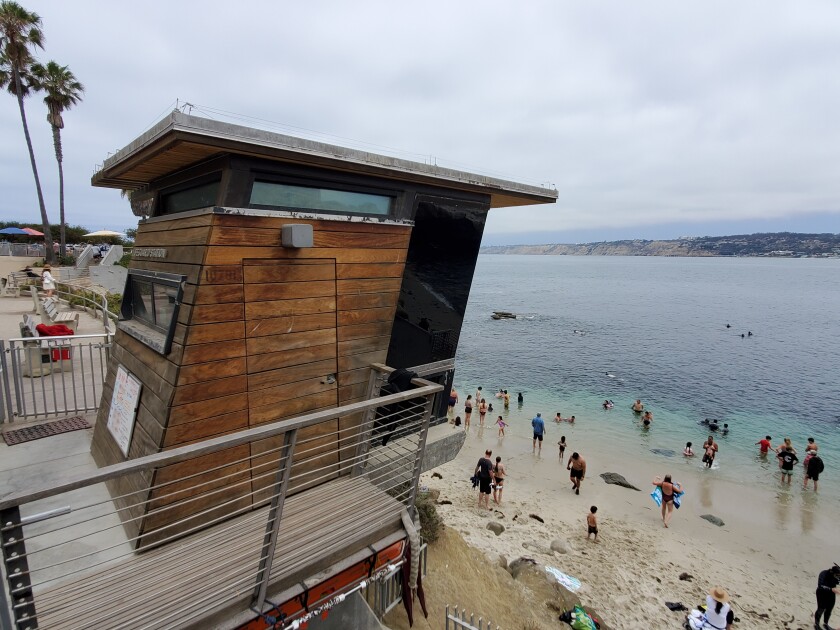 Lifeguards watch over La Jolla Cove from a tower on the edge of Scripps Park.