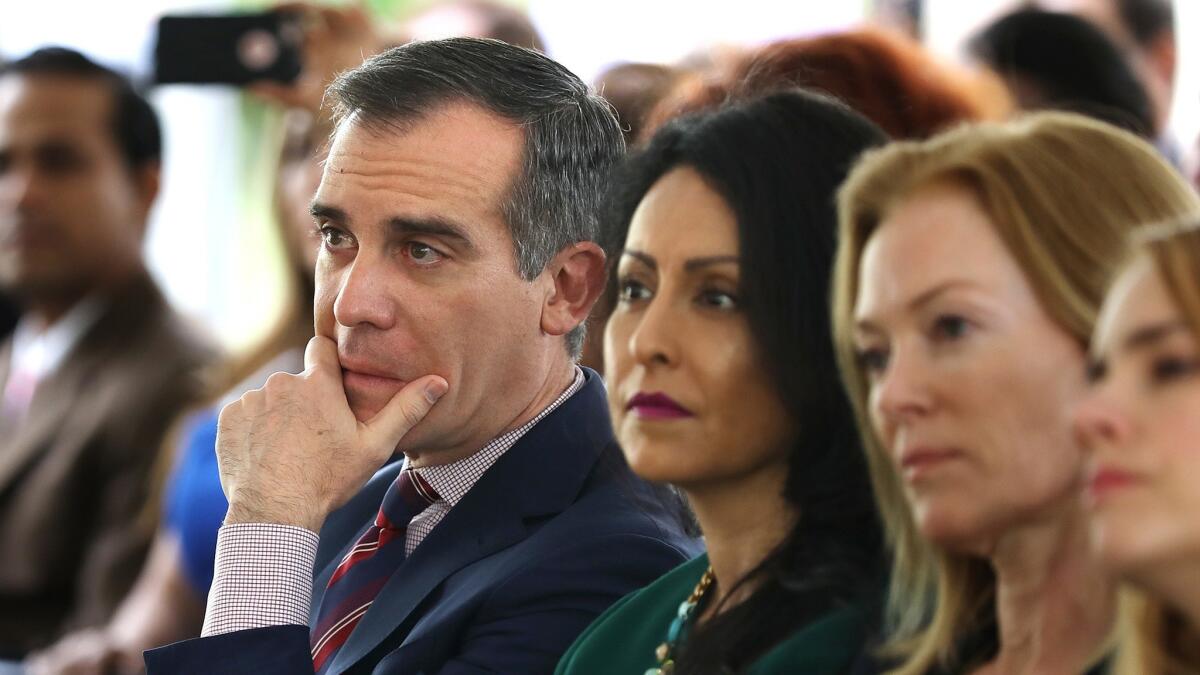 Mayor Eric Garcetti, left, and City Councilwoman Nury Martinez, center, listen to a panel of women discuss their experiences with sexual harassment in the workplace during the Getty House Foundation Women's Leadership Series in Los Angeles on April 30.