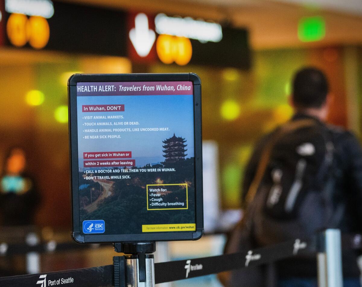 A health alert is displayed at Sea-Tac International Airport in Seattle. 