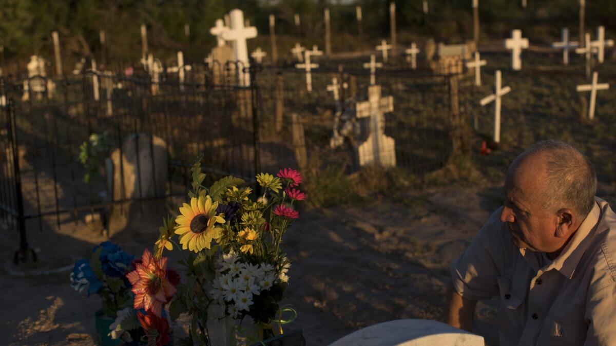 Mauricio Vidaurri worries about losing access to the nearly 200-year-old family cemetery on his property south of Laredo, Texas.