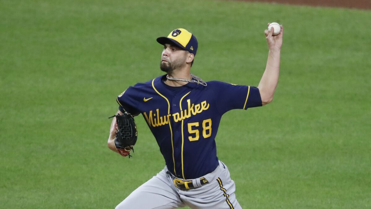Álex Claudio delivers during a game between the Milwaukee Brewers and the Pittsburgh Pirates in August.
