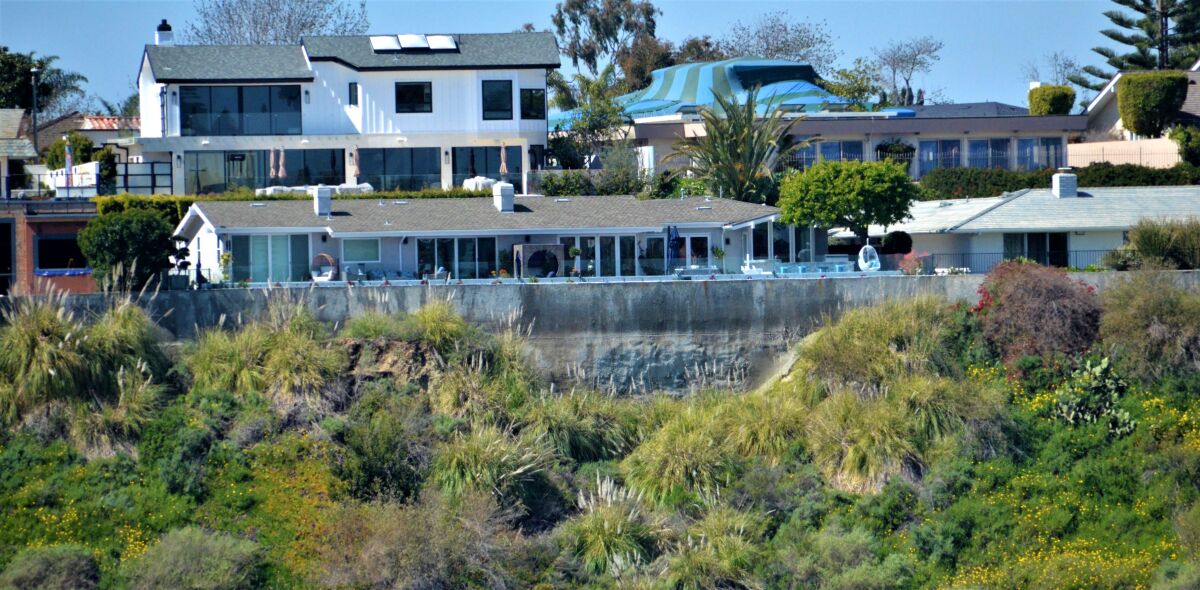 A property at 1950 Galaxy Drive is one of four on the street that shored up a slumping hillside in the '90s with a wall.