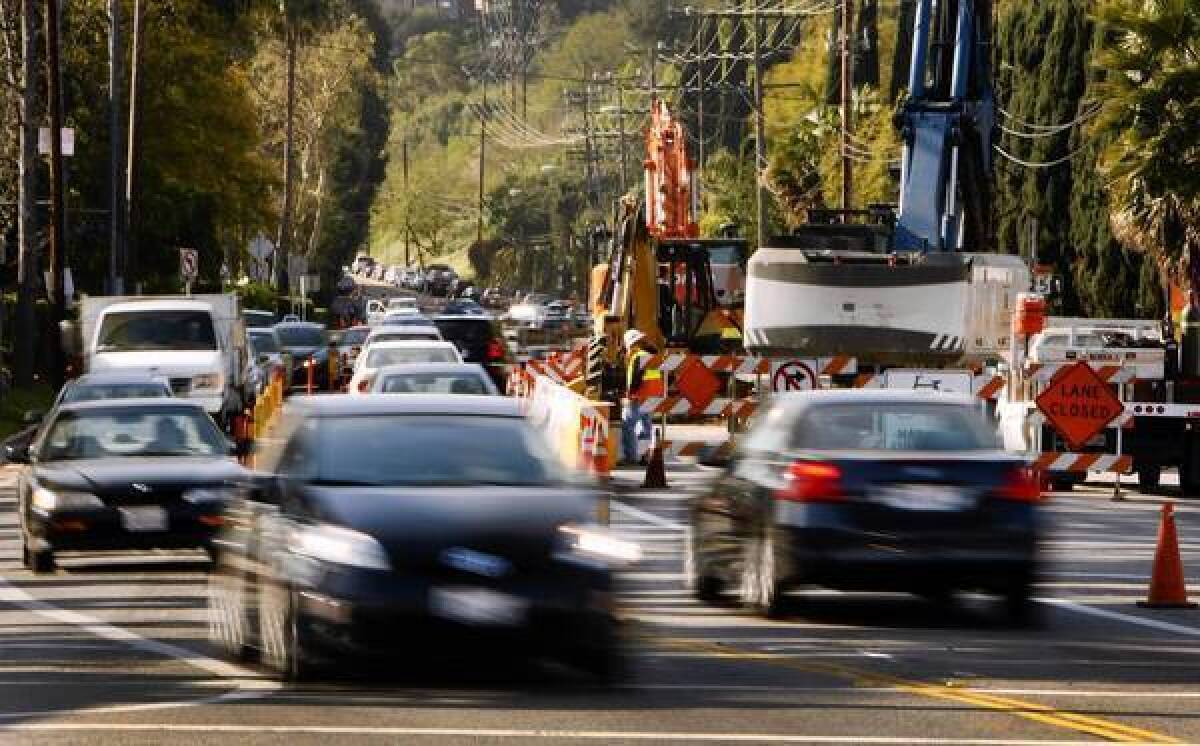 Traffic begins to back up on Coldwater Canyon Avenue at Ventura Boulevard in Studio City on a spring Friday morning. The important commuter route will be closed for major portions of the day, except Sundays, between Ventura Boulevard and Mulholland Drive for about a month while the DWP replaces an old water main.